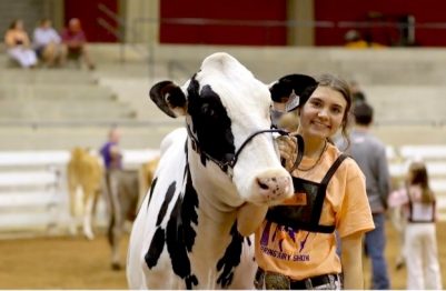 Salem Sifford with a Holstein dairy cow