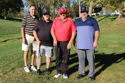 Team Advance Agra Systems, standing together, facing the camera on the golf course.