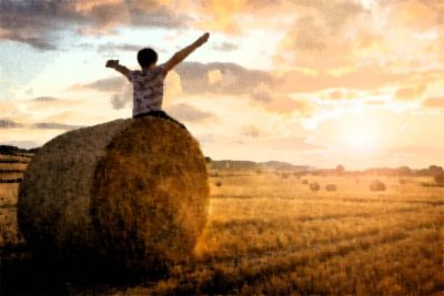 Illustration of a youth sitting on a round bale in a field full of round bales, arms wide in the sunrise.