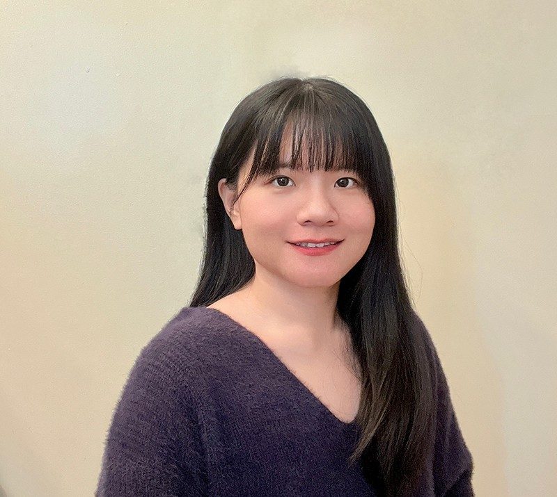 Photo of Mingsi Liao against a light background.