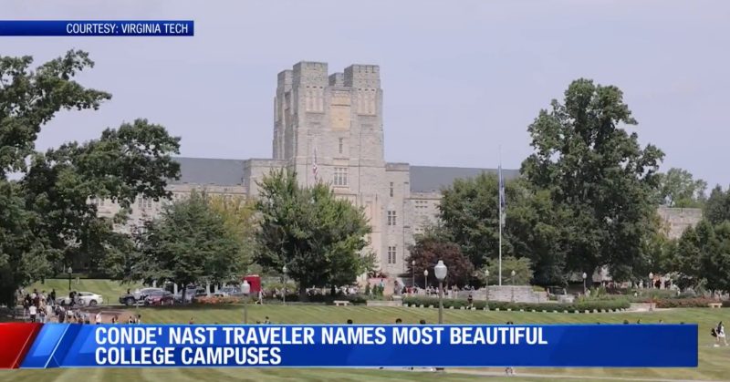Burruss Hall with green trees, flags, the memorial stones, hub of activity with students. Blue sky.