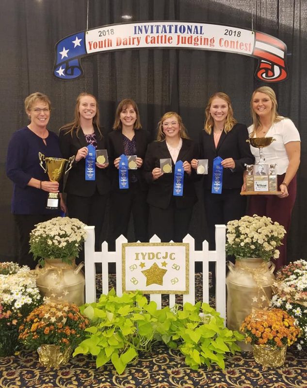 Team A: (L-R) Dr. Katharine Knowlton (coach),  Katelyn Allen, Leah Hall, Sarah Thomas, Shelby Iager, Kayla Umbel (assistant coach). Holding blue ribbons and trophies.