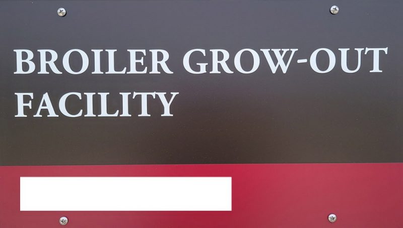 Building nameplate: Broiler Grow-Out Facility. Address blocked.