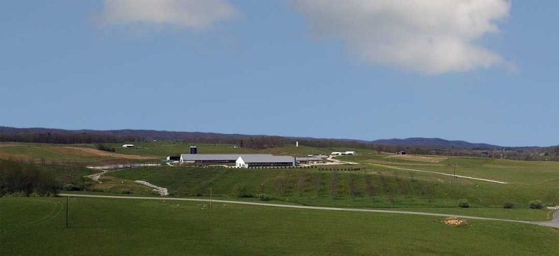 Ariel view of the Dairy Complex at Kentland Farms. Blue sky, green pastures.
