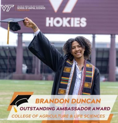 Brandon Duncan on the football field at Lane Stadium wearing graduation regalia, smiling. Home of the VT Hokies sign in the background.Text: Brandon Duncan, Outstanding Ambassador Award. College of Agriculture & Life Sciences.