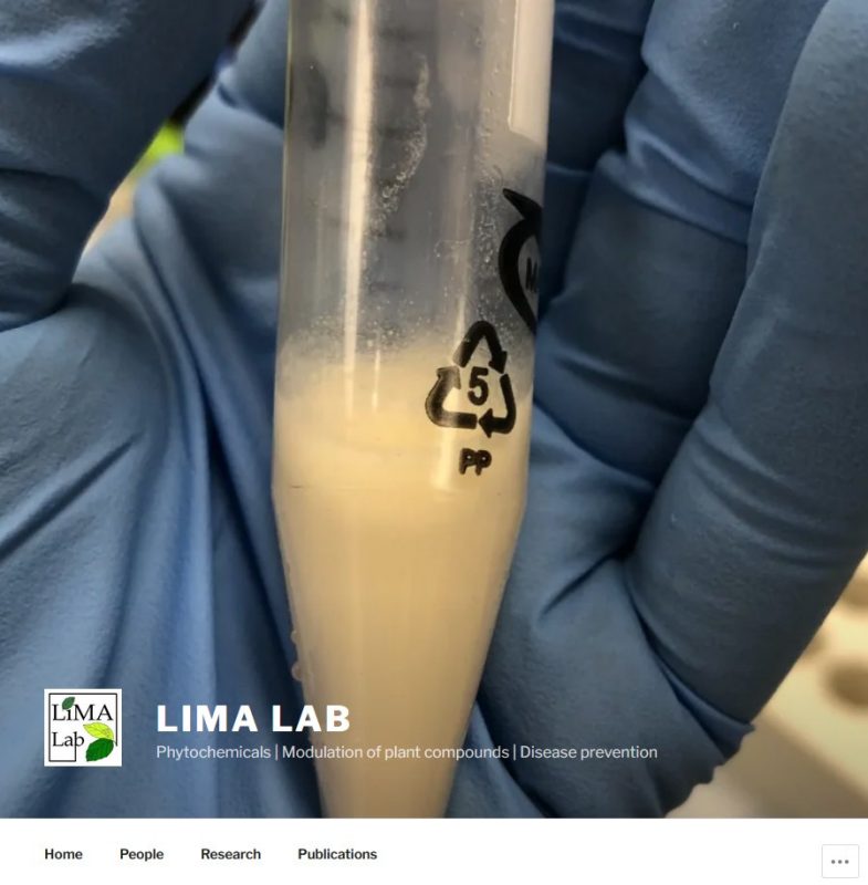 Gloved hand hold a sample in a tube. "Lima Lab" Phytochemicals | Modulation of plant compounts | Disease prevention